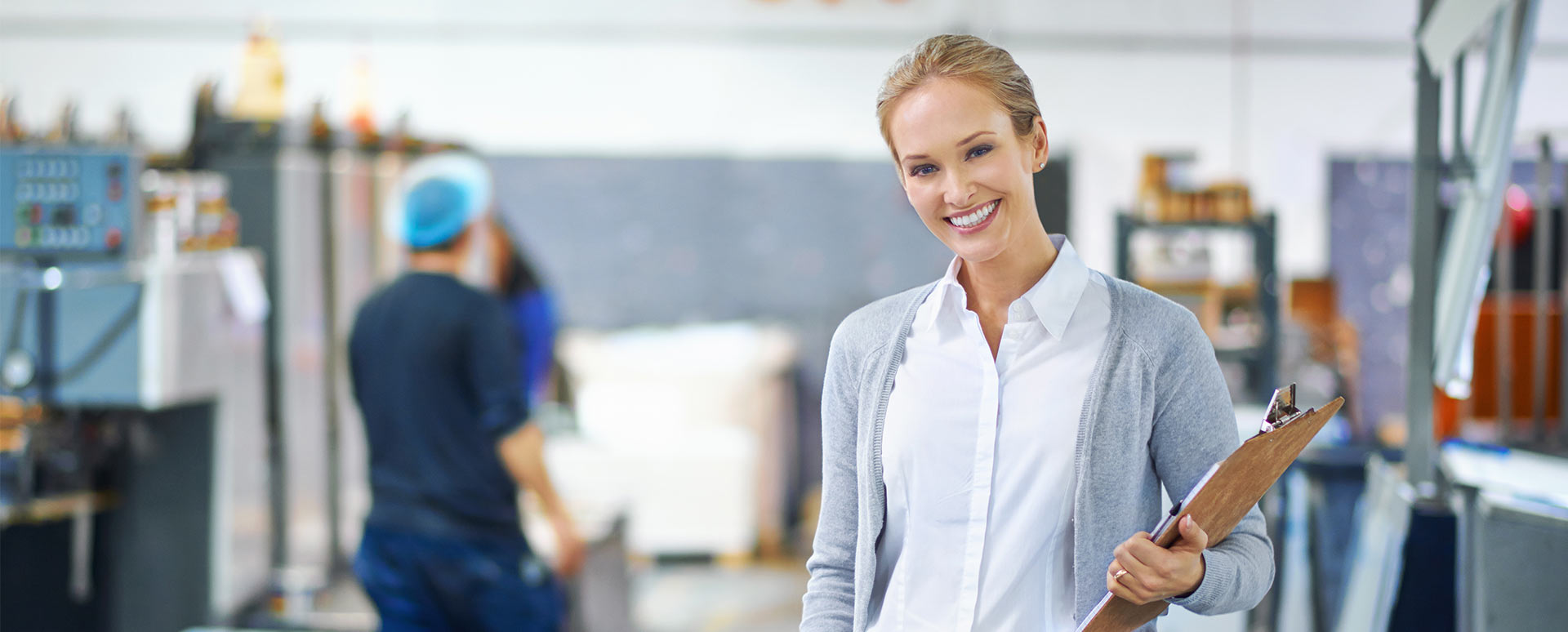 woman with a clipboard in a warehouse